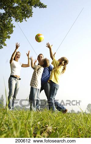 Family playing with ball View Large Photo Image Stock Image - Family playing with ball . Fotosearch