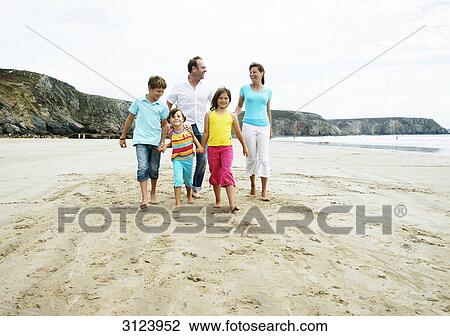 Family walking on the beach, front view View Large Photo Image Stock Image - Family walking on the beach, front view . Fotosearch