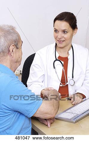 Female doctor shaking hand with patient View Large Photo Image Stock Photo - Female doctor shaking hand with patient . Fotosearch