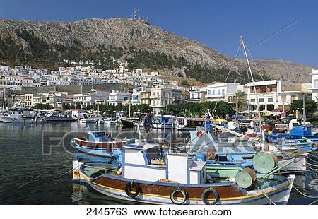 Fishing boats at harbor, Pothia, Kalymnos, Dodecanese Islands, Aegean Islands, Greece View Large Photo Image Stock Image - Fishing boats at harbor, Pothia, Kalymnos, Dodecanese Islands, Aegean Islands, Greece . Fotosearch