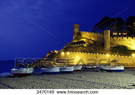 Stock Photo - Fishing boats in front of castle, Vila Vella, Tossa de Mar, Costa Brava, Catalonia, Spain . Fotosearch
