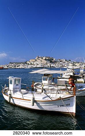 Fishing boats moored at harbor View Large Photo Image Stock Image - Fishing boats moored at harbor . Fotosearch