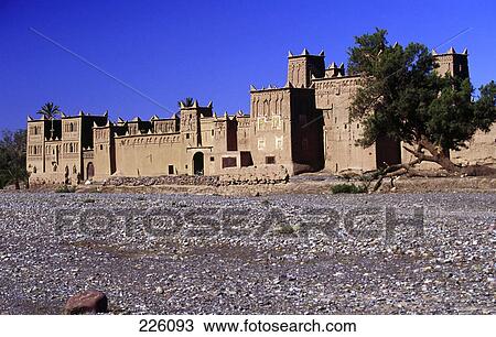Fort on arid landscape against blue sky, Dades Valley, Morocco View Large Photo Image Stock Image - Fort on arid landscape against blue sky, Dades Valley, Morocco . Fotosearch