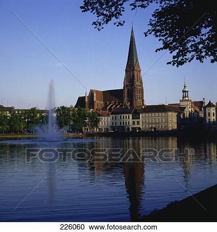 Stock Image - Fountain in pond, Pfaffenteich, Schwerin, Germany . Fotosearch