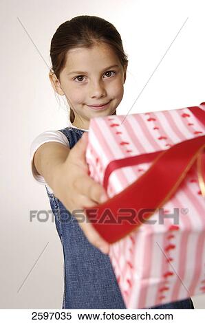 Stock Photography - Girl holding present . Fotosearch