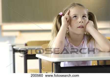 Girl sitting in elemantary school View Large Photo Image Stock Image - Girl sitting in elemantary school . Fotosearch