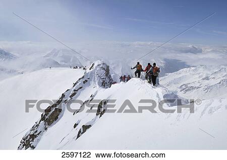 Group of mountain hikers on mountain peak, Trentino-Alto Adige, Italy View Large Photo Image Stock Image - Group of mountain hikers on mountain peak, Trentino-Alto Adige, Italy . Fotosearch