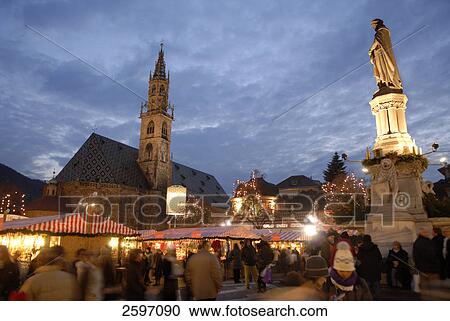 Stock Image - Group of people at Christmas market, Trentino-Alto Adige, Italy . Fotosearch