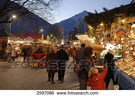 Group of people at market, Trentino-Alto Adige, Italy View Large Photo Image Stock Photograph - Group of people at market, Trentino-Alto Adige, Italy . Fotosearch