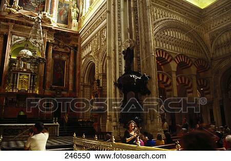 Stock Image - Group of people in cathedral, Mezquita Cathedral, Cordoba, Andalusia, Spain . Fotosearch