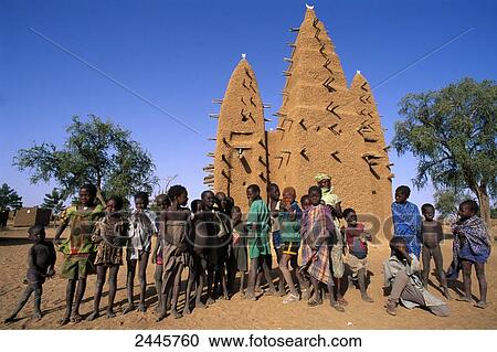 Stock Image - Group of people in front of mosque, Dogonland, Mali . Fotosearch