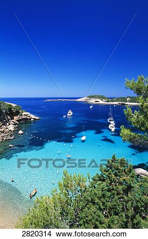 Picture - High angle view of boats in sea near coast, Portinatx, Ibiza, Balearic Islands, Spain . Fotosearch