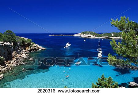 High angle view of boats in sea near coast, Portinatx, Ibiza, Balearic Islands, Spain View Large Photo Image Stock Photograph - High angle view of boats in sea near coast, Portinatx, Ibiza, Balearic Islands, Spain . Fotosearch