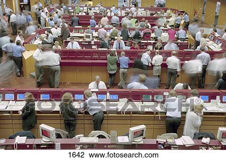 Stock Image - High angle view of group of people in stock exchange building, Frankfurt, Germany . Fotosearch