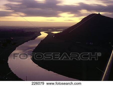 Stock Photo - High angle view of river flowing through landscape, Porta Westfalica, Weserdurchbruch, Wiehengebirge, North Rhine-Westphalia, Germany . Fotosearch