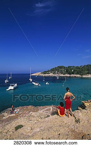 High angle view of tourists at coast, Cala Salada, Ibiza, Balearic Islands, Spain View Large Photo Image Stock Photo - High angle view of tourists at coast, Cala Salada, Ibiza, Balearic Islands, Spain . Fotosearch