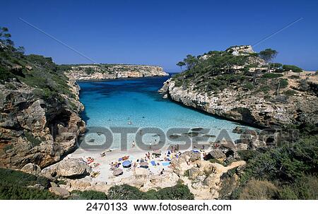 High angle view of tourists on beach, Cala S'Almonia, Majorca, Balearic Islands, Spain View Large Photo Image Stock Image - High angle view of tourists on beach, Cala S'Almonia, Majorca, Balearic Islands, Spain . Fotosearch