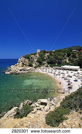 High angle view of tourists on beach, Cala Carbo, Ibiza, Balearic Islands, Spain View Large Photo Image Stock Image - High angle view of tourists on beach, Cala Carbo, Ibiza, Balearic Islands, Spain . Fotosearch