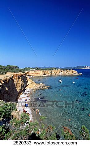 High angle view of tourists on beach, Sa Caleta, Ibiza, Balearic Islands, Spain View Large Photo Image Stock Image - High angle view of tourists on beach, Sa Caleta, Ibiza, Balearic Islands, Spain . Fotosearch