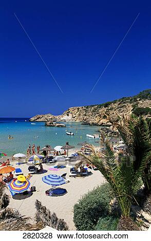 High angle view of tourists on beach, Cala Tarida, Ibiza, Balearic Islands, Spain View Large Photo Image Stock Photo - High angle view of tourists on beach, Cala Tarida, Ibiza, Balearic Islands, Spain . Fotosearch