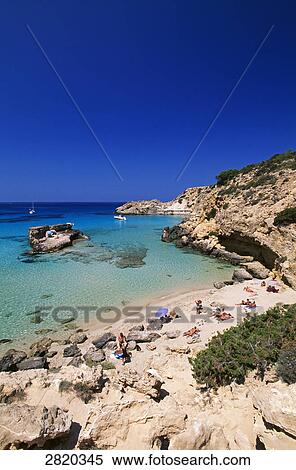 High angle view of tourists on beach, Cala Tarida, Ibiza, Balearic Islands, Spain View Large Photo Image Stock Photography - High angle view of tourists on beach, Cala Tarida, Ibiza, Balearic Islands, Spain . Fotosearch