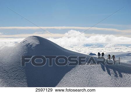 Hikers hiking on snow covered mountain View Large Photo Image Stock Photo - Hikers hiking on snow covered mountain . Fotosearch