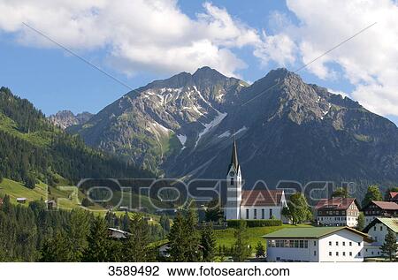 Stock Image - Hirschegg with Elferkopf and Zwoelferkopf, Vorarlberg, Austria, Europe . Fotosearch