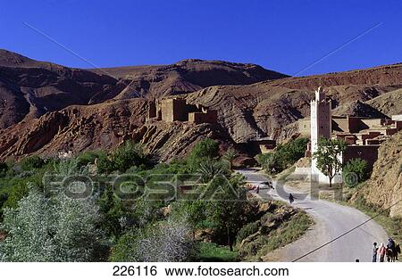 Houses along road on arid landscape, Dades Valley, Morocco View Large Photo Image Stock Photograph - Houses along road on arid landscape, Dades Valley, Morocco . Fotosearch