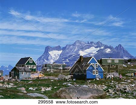 Stock Photo - Houses with snowcapped mountains in background, Aappilattoq, Kujalleq, Greenland . Fotosearch