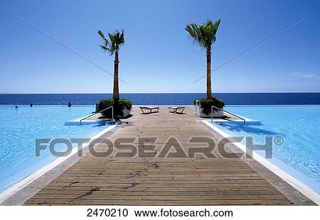 Jetty in infinity pool, Funchal, Madeira, Portugal View Large Photo Image Stock Image - Jetty in infinity pool, Funchal, Madeira, Portugal . Fotosearch