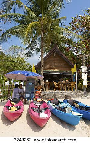 Stock Image - Kayaks and bar, Rai Leh West Beach, Krabi, Thailand . Fotosearch