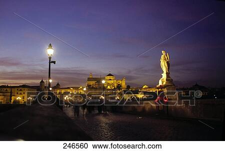Lamppost lit up on bridge with cathedral in background, Mezquita Cathedral, Cordoba, Andalusia, Spain View Large Photo Image Stock Image - Lamppost lit up on bridge with cathedral in background, Mezquita Cathedral, Cordoba, Andalusia, Spain . Fotosearch