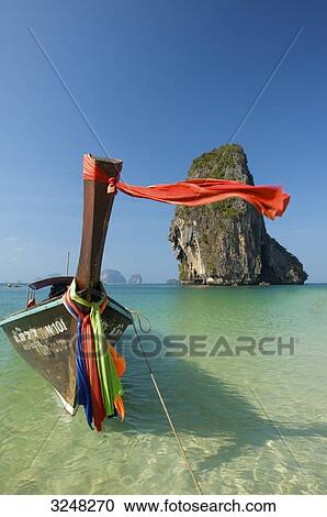 Stock Image - Longtail boat, Laem Phra Nang Beach, Krabi, Thailand . Fotosearch