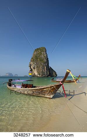 Longtail boats, Laem Phra Nang Beach, Krabi, Thailand View Large Photo Image Stock Photo - Longtail boats, Laem Phra Nang Beach, Krabi, Thailand . Fotosearch