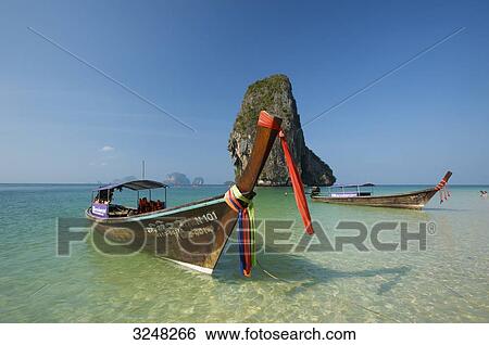 Stock Photograph - Longtailboats, Laem Phra Nang Beach, Krabi, Thailand . Fotosearch