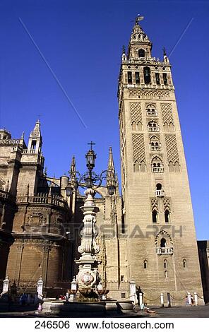 Stock Photograph - Low angle view of bell tower of cathedral, Seville Cathedral, Seville, Andalusia, Spain . Fotosearch