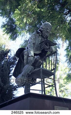 Stock Photography - Low angle view of statue of Mozart, Seville, Andalusia, Spain . Fotosearch