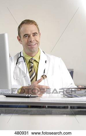 Male doctor smiling View Large Photo Image Stock Image - Male doctor smiling . Fotosearch