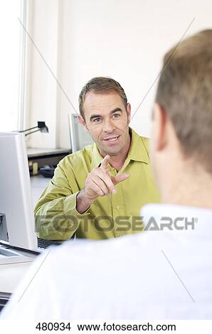 Male doctor talking to patient View Large Photo Image Picture - Male doctor talking to patient . Fotosearch