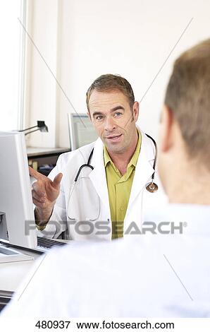 Male doctor talking to patient View Large Photo Image Stock Photo - Male doctor talking to patient . Fotosearch