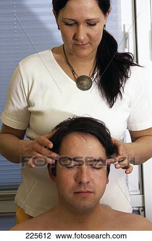 Man getting head massage from woman View Large Photo Image Stock Image - Man getting head massage from woman . Fotosearch