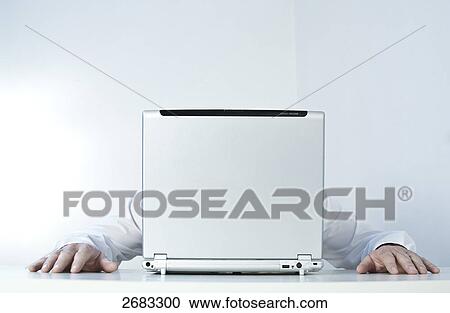 man hiding behind his notebook View Large Photo Image Stock Image - man hiding behind his notebook . Fotosearch