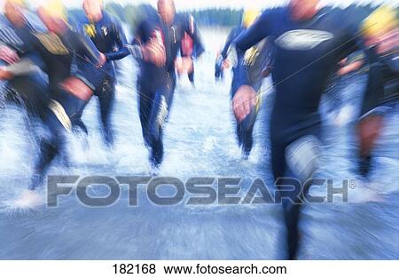 Stock Photo - Men running in water . Fotosearch