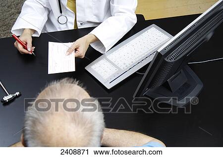 Stock Image - Mid section view of female doctor giving a prescription to patient . Fotosearch
