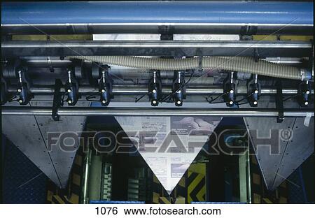 Newspapers being printed and folded on rotary printing machine, Germany View Large Photo Image Stock Photograph - Newspapers being printed and folded on rotary printing machine, Germany . Fotosearch