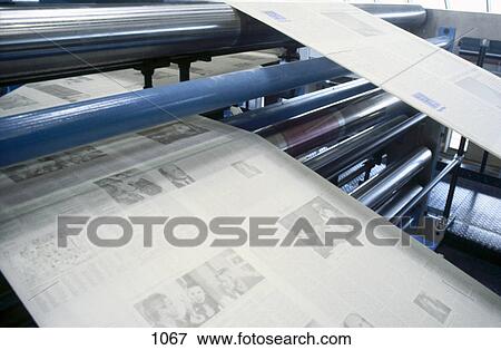 Newspapers being printed on printing machine View Large Photo Image Stock Photo - Newspapers being printed on printing machine . Fotosearch