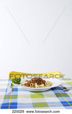 Pasta with sauce and parsley on plate View Large Photo Image Stock Photo - Pasta with sauce and parsley on plate . Fotosearch