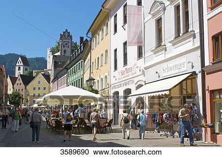 Stock Image - Pedestrian zone with Abbey Saint Mang and Hohes Schloss, Fuessen, Bavaria, Germany, Europe . Fotosearch