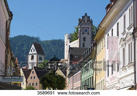 Stock Image - Pedestrian zone with Abbey Saint Mang and Hohes Schloss, Fuessen, Bavaria, Germany, Europe . Fotosearch