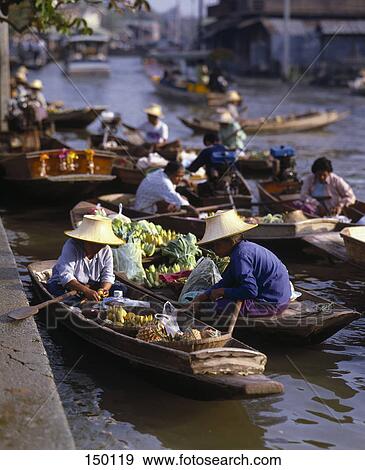 Stock Photo - People at floating market, Damnoen Saduak Floating Market, Ratchaburi Province, Thailand . Fotosearch